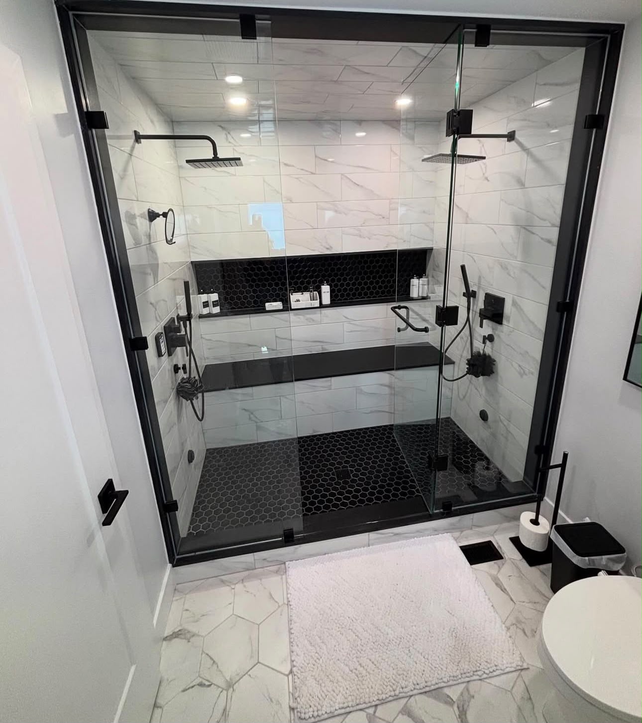Luxury walk-in shower with dual rainheads installed by Richmond Hill Plumbing